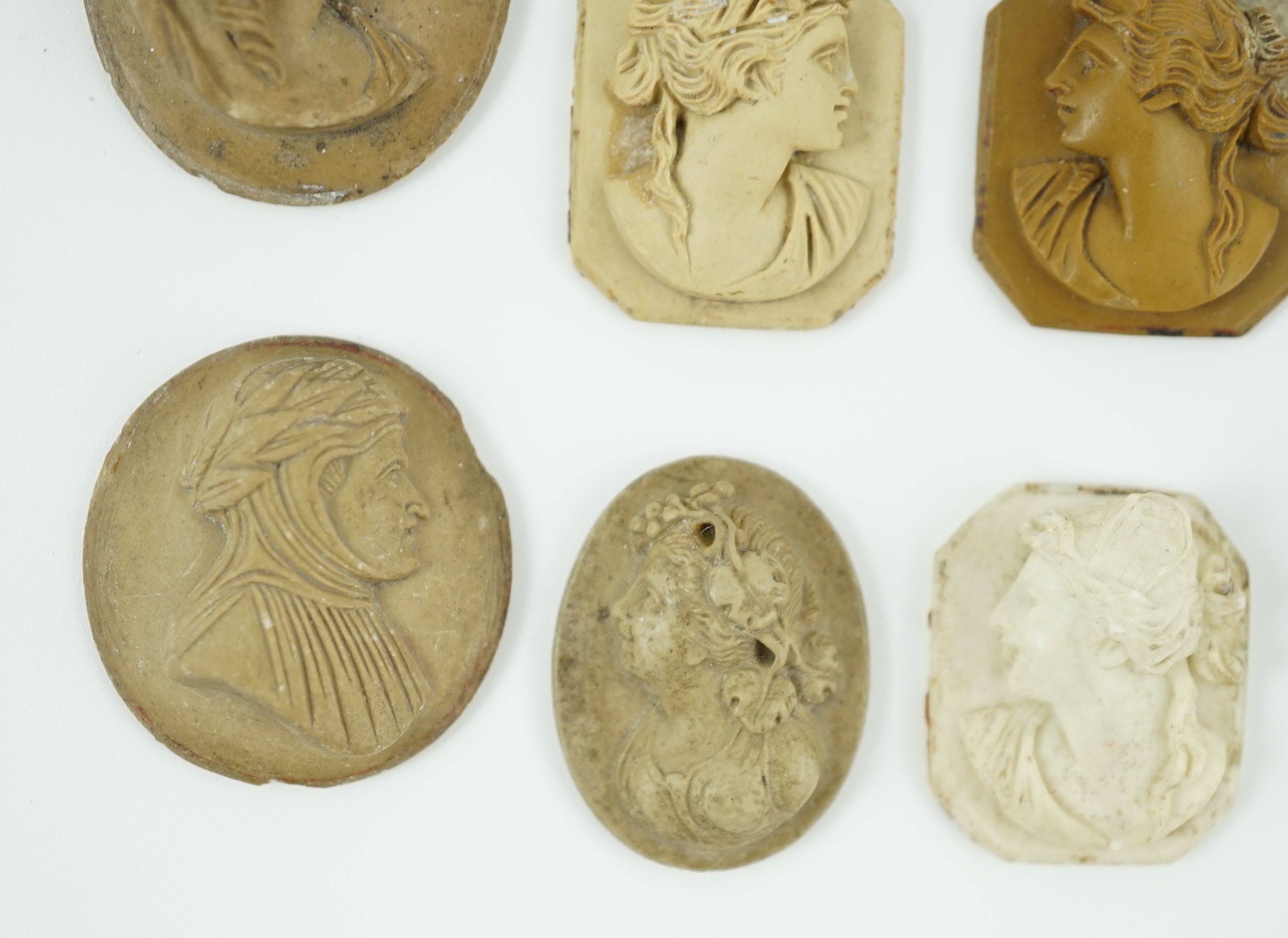 An antique hardstone cameo of Hermes and nine Italian lava cameos largest 2.75 x 2.25cm.